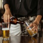 beginner's guide to beer style illustrated by a waiter pouring beer at a table