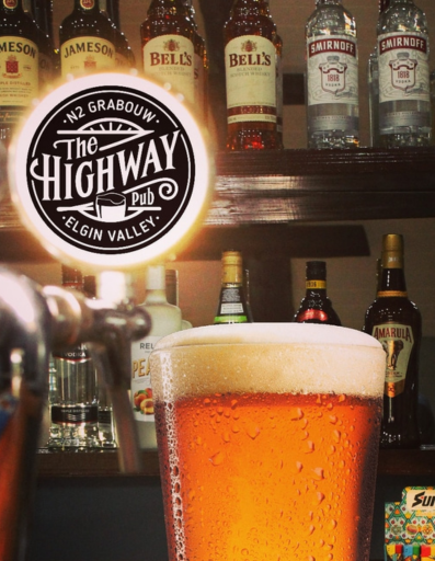 beer at the bar with the Highway Pub logo