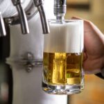 Fresh draught beer showing why drinks taste better from glass than plastic
