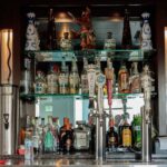 Traditional wooden bar counter with modern draught beer taps at The Highway Pub